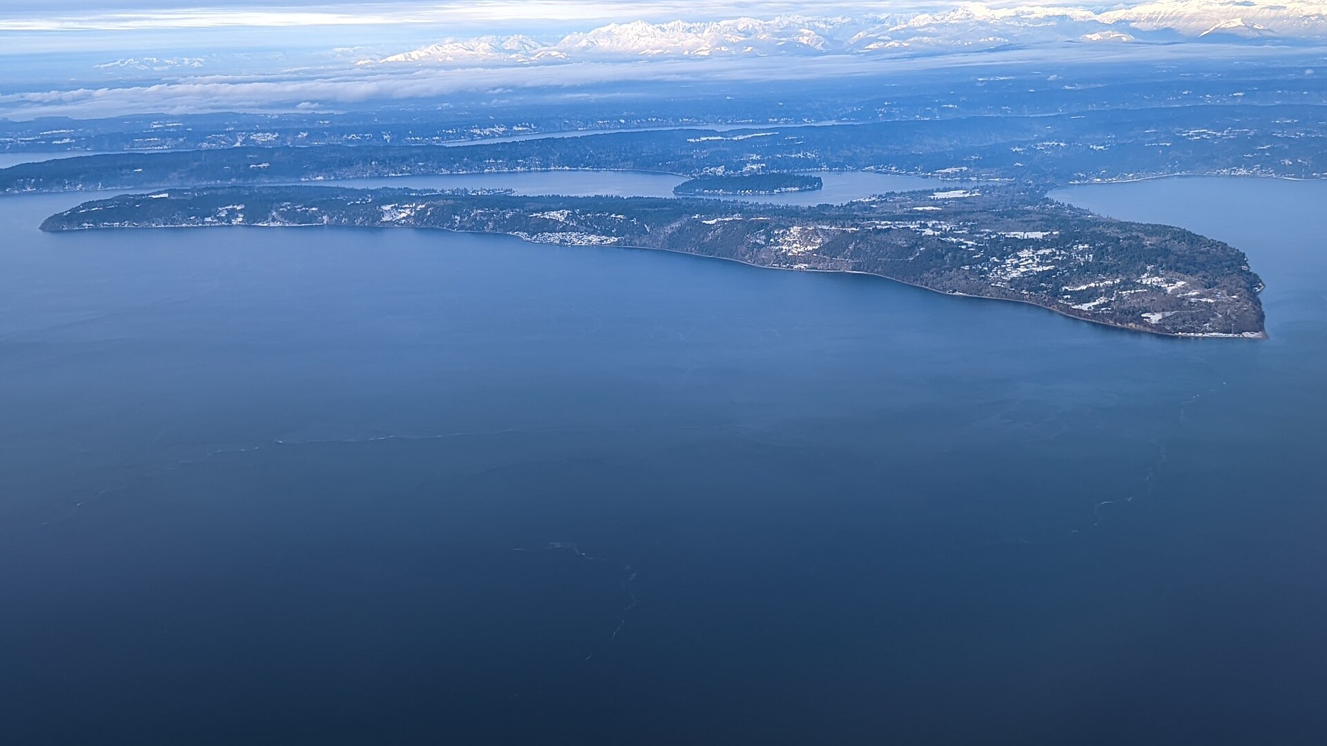 Maury Island, Puget Sound. On 21 June 1947 — three days before Kenneth Arnold's Mount Rainier sighting — Harold Dahl claimed six 'donut-shaped' craft dropped slag onto his boat near here. Two USAAF investigators died in a B-25 crash while transporting the alleged debris.