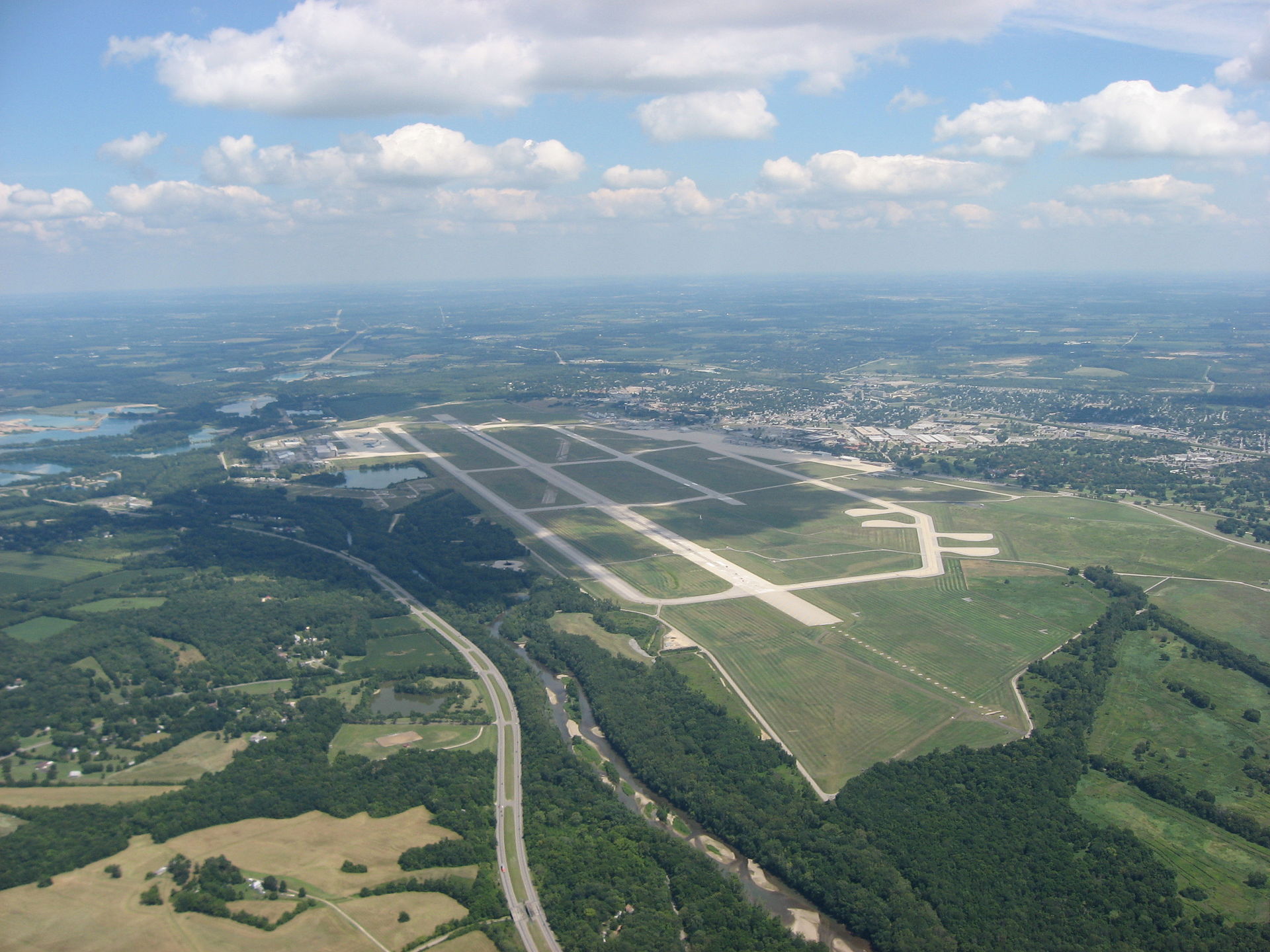Wright-Patterson Air Force Base from above. The persistent Roswell rumor — that wreckage was flown here for analysis on 8 July 1947 — is denied by USAF; multiple Project Blue Book staff who worked the building have likewise denied seeing alien material.